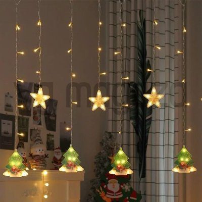 Novogodišnje LED zavese žute boje sa zvezdicama i jelkicama.